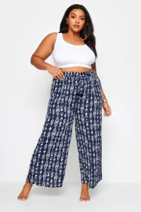 YOURS Curve Navy Blue Ikat Print Crinkle Tassel Trousers